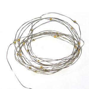 Pisca-pisca com  50 Mini Led Arame Pilha 3000K - Taschibra
